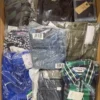 The photo shows a package with clothing in the category AM.