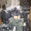 The photo shows a package with clothing in the category AM.