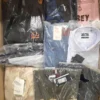 The photo shows a package with clothing in the category AM.
