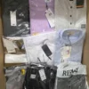 The photo shows a package with clothing in the category AM.