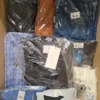 The photo shows a package with clothing in the category AM.