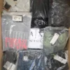 The photo shows a package with clothing in the category AM.