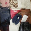 The photo shows a package with clothing in the category TSC.
