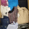 The photo shows a package with clothing in the category TSC.