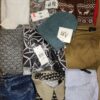 The photo shows a package with clothing in the category TSC.