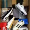 The photo shows a package with footwear in the category CS.