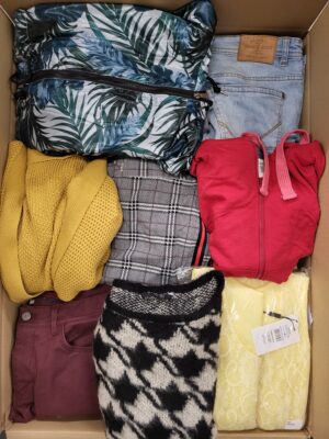 The photo shows a package with clothing in the category TSC.