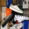 The photo shows a package with footwear in the category CS.