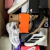 The photo shows a package with footwear in the category CS.