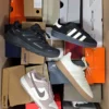 The photo shows a package with footwear in the category CS.