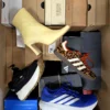 The photo shows a package with footwear in the category CS.