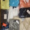 The photo shows a package with clothing in the category AW.