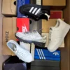 The photo shows a package with footwear in the category CS.