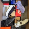 The photo shows a package with footwear in the category CS.