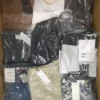 The photo shows a package with clothing in the category AP.