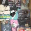 The photo shows a package with clothing in the category AP.