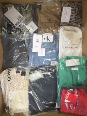 The photo shows a package with clothing in the category AP.