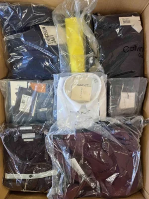 The photo shows a package with clothing in the category AP.