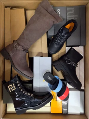 The photo shows a package with footwear in the category AS.