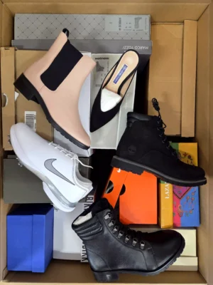 The photo shows a package with footwear in the category AS.