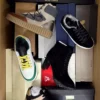 The photo shows a package with footwear in the category AS.