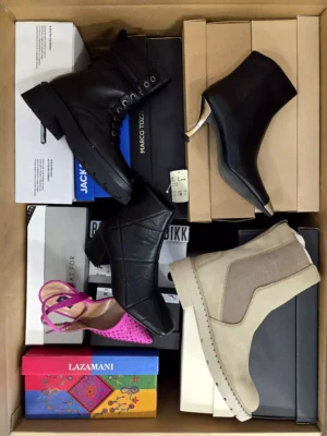 The photo shows a package with footwear in the category AS.