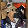 The photo shows a package with footwear in the category AS.