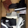 The photo shows a package with footwear in the category AS.