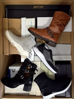 The photo shows a package with footwear in the category AS.