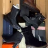 The photo shows a package with footwear in the category AS.