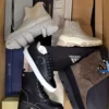 The photo shows a package with footwear in the category AS.