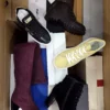 The photo shows a package with footwear in the category AS.