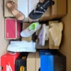 The photo shows a package with footwear in the category AS.