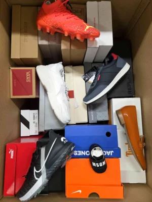 The photo shows a package with footwear in the category AS.