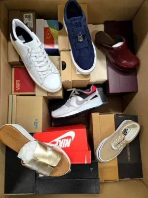 The photo shows a package with footwear in the category AS.