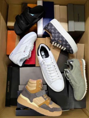 The photo shows a package with footwear in the category AS.