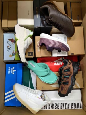 The photo shows a package with footwear in the category AS.