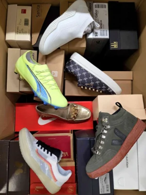 The photo shows a package with footwear in the category AS.