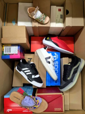 The photo shows a package with footwear in the category AS.