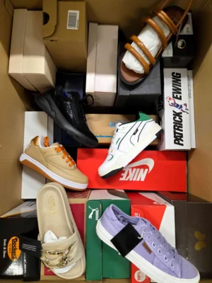 The photo shows a package with footwear in the category AS.