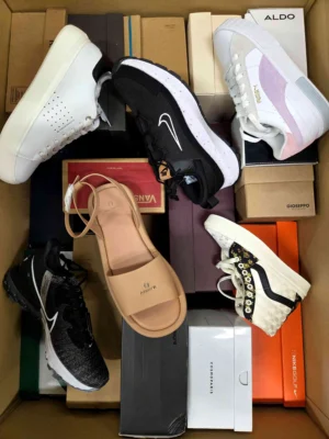 The photo shows a package with footwear in the category AS.