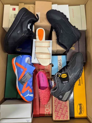 The photo shows a package with footwear in the category AS.