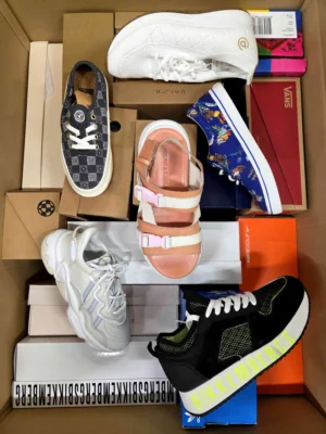 The photo shows a package with footwear in the category AS.