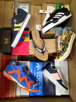 The photo shows a package with footwear in the category AS.