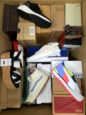 The photo shows a package with footwear in the category AS.
