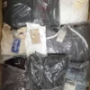 The photo shows a package with clothing in the category D.