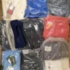 The photo shows a package with clothing in the category D.