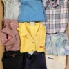 The photo shows a package with clothing in the category U.