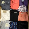 The photo shows a package with clothing in the category U.