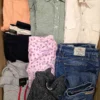 The photo shows a package with clothing in the category U.
